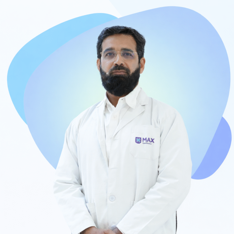 Dr. Waliullah Siddiqui wearing a white medical coat at Max Healthcare hospital